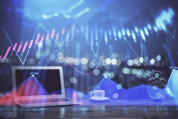 Forex Chart hologram on table with computer background. Multi exposure. Concept of financial...