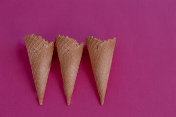 Waffle cone or ice cream cones in various type  isolated in pink
 