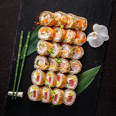 tasty sushi on the black background