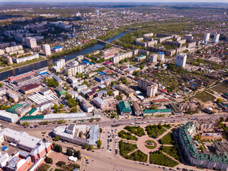 Aerial view of modern cityscape of old Russian town of Oryol located on banks of Orlik River in springtime.. - obrazy, fototapety, plakaty