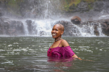 Black woman playing in the water