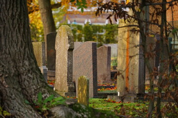 Grave yard where grave stones are in memory of the deceased. The end of a person and a memory of life. Bereavement processing. Sadness and tribute to life.