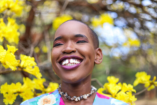 Black woman smiling  and looking away from the camera