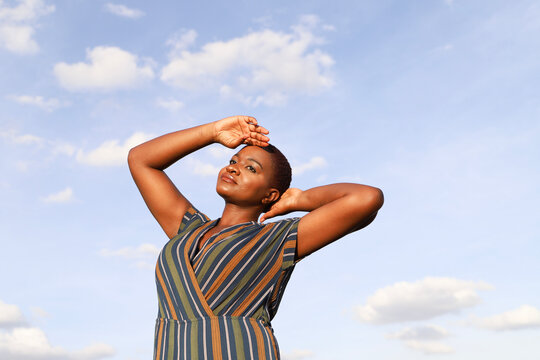 Black woman with head in the sky