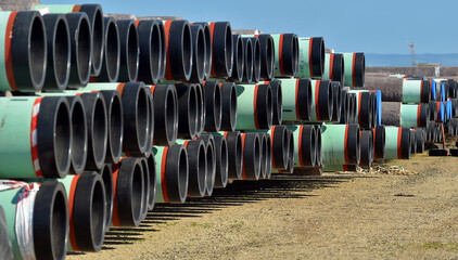 HUge pipes stacked in a refinery storage yard before transportaion to pipeline build in the southern Highlands PNG