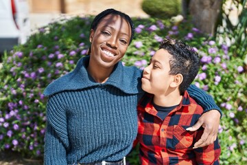Fototapeta premium African american mother and son smiling confident hugging each other at park