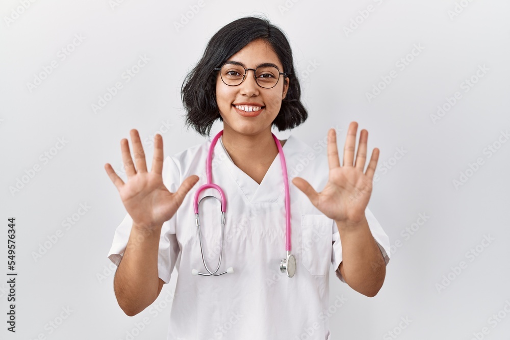 Sticker young hispanic doctor woman wearing stethoscope over isolated background showing and pointing up wit