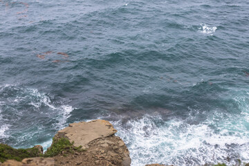 Aerial view of sea waves and fantastic Rocky coast.  Sea waves hitting rocks