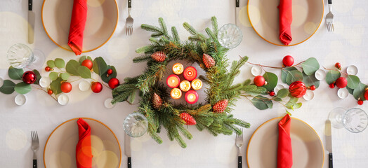 Beautiful table setting for Christmas dinner, top view