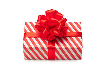 Close up shot of present box wrapped in red and white striped paper and decorated with a bow, isolated on white background