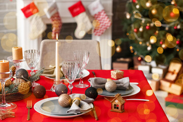 Stylish table setting for Christmas dinner at home