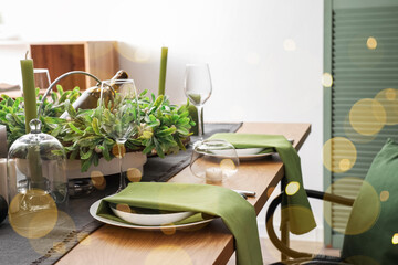 Romantic table setting for Christmas dinner at home