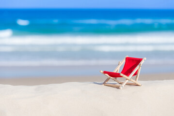 Fototapeta na wymiar Concept of a sun lounger on a beautiful beach