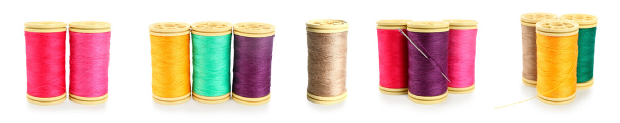 Set of colorful thread spools on white background