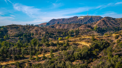 Los Angeles natural woodland park with Hollywood Sign on the Hollywood Hills, view from Griffith Observatory, California, USA - Powered by Adobe