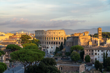 Fototapeta premium The Roman Coliseum at Sunset Seen from the Altar of the Fatherland