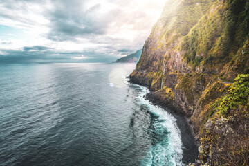 Waterfall flowing into the sea in a picturesque morning atmosphere. Viewpoint Véu da Noiva,...