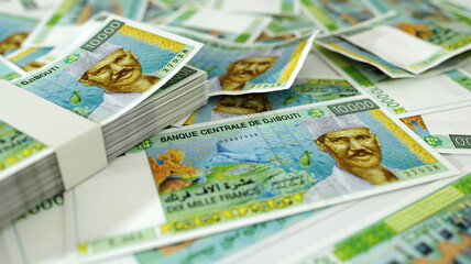 Obraz na płótnie Canvas close up of Djiboutian franc notes spread on table. 3d rendering of money scattered on surface