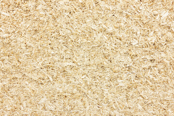 OSB board texture. Brown wooden background. Simple pressed chipboard pattern. Chip board background. Brown wood texture.