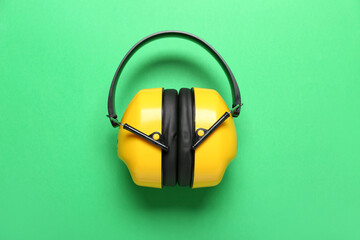 Hearing protectors on green background