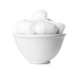 Bowl of soft cotton balls on white background