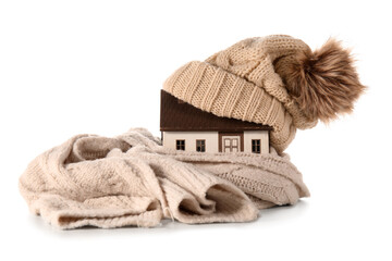 House model with hat and scarf on white background. Heating concept