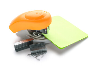 Office stapler with sticky notes and staples on white background