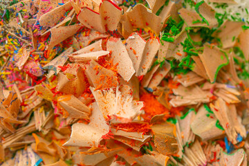 Drawing and creativity concept.Pencil shavings texture in the sun.School and education .Pencil shavings colorful background.