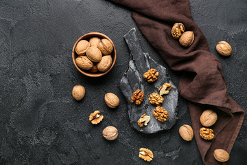Obraz na płótnie Canvas Composition with fresh walnuts on dark background