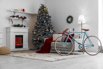 Obraz premium Interior of living room with bicycle, sofa and Christmas tree
