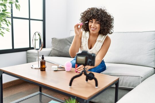 Young middle east woman smiling confident recording makeup tutorial at home