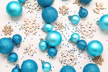Composition with beautiful Christmas balls and decor on light background