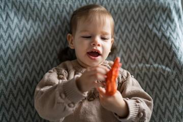 One small Caucasian girl little child toddler hold finger puppet toy