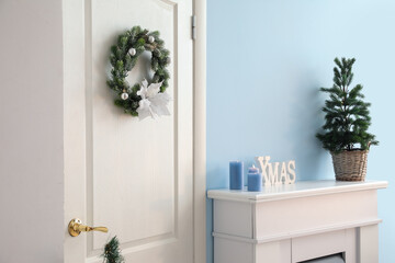 White door with Christmas wreath in living room