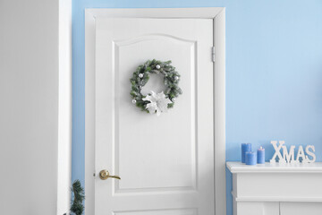 White door with Christmas wreath in living room