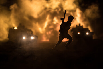 War Concept. Battle scene on war fog sky background, Fighting silhouettes Below Cloudy Skyline at...