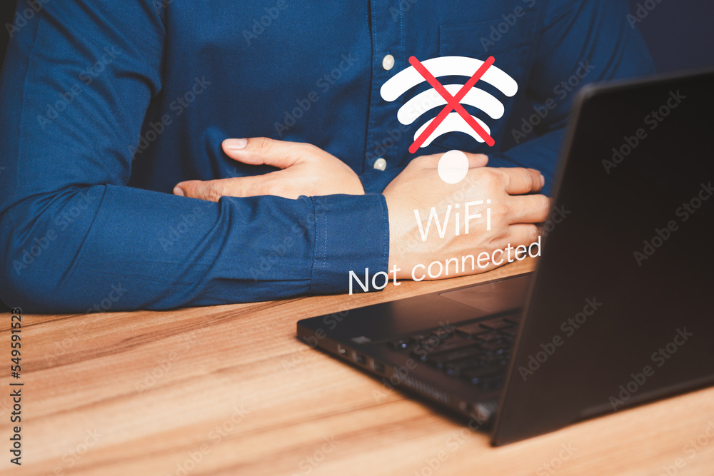 Poster Man using a computer laptop to connect to wifi but wifi not connected, and waiting to loading digital business data form website, concept technology of waiting for connect to wifi.