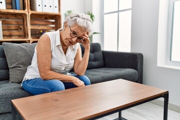 Senior grey-haired woman patient depressed at psychology center