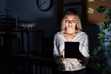 Young woman business worker using touchpad working at office