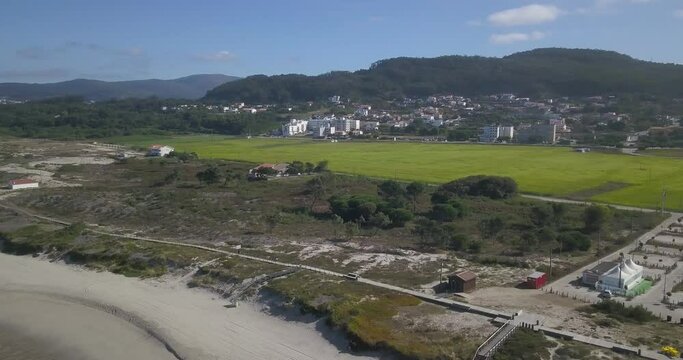 Aerial orbit relaxing view of portuguese northern beach of Afife, Viana do Castelo, Portugal