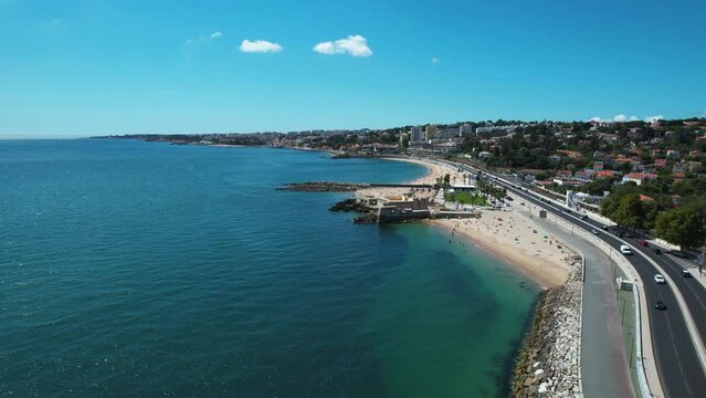 Aerial view away from the Fort of Sao Bruno fortress, in sunny Caxias, Portugal - pull back, drone shot