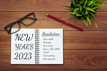 2023 Happy New Year Resolution Goal List and Plans Setting - Business office desk with notebook...