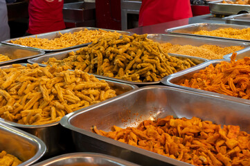 Bhujia, a spicy deep-fried sev filled with a burst of flavors, made using gram flour, moth flour, and different spices, crispy & crunchy traditional namkeen being sold in Jodhpur, Rajasthan, India.