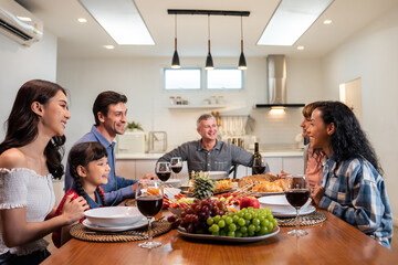 Big family having dinner, enjoying evening party in house together.