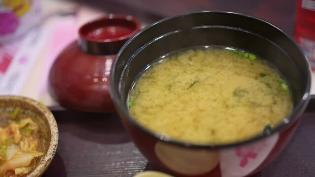Traditional Japanese miso soup at restaurant.