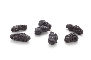 Dried black mulberries on white background