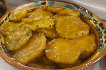 Pineapple fruit in homemade syrup, in a clay pot, a typical Mexican sweet