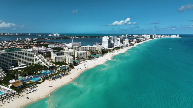 Aerial view of beaches and the Hotel zone, sunny day in Cancun, Mexico - rising, drone shot