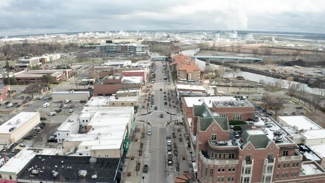 Downtown Midland, Michigan with drone video moving forward.
