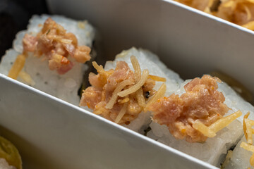 delivery of sushi roll at home with Chinese sticks and ginger